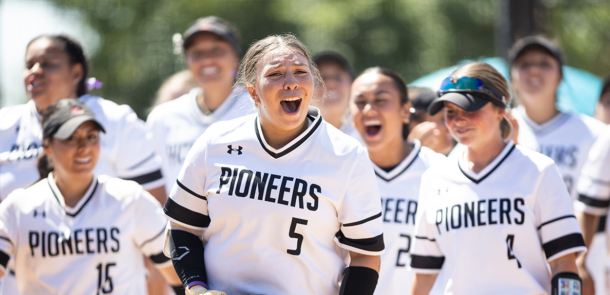 Pioneer Women's Softball team celebrating after win