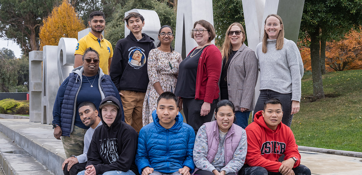 Think By the Bay students posing by the East bay Letters