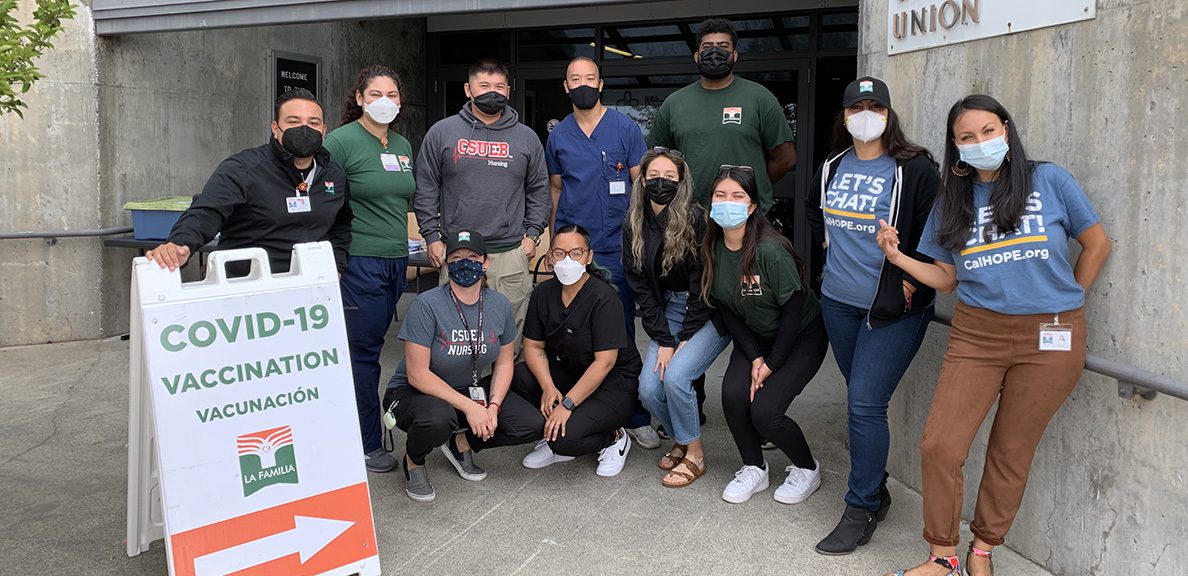 Group of people standing outside vaccine clinic