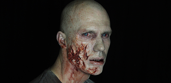 A zombie man with face trauma