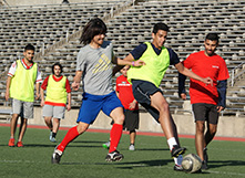 Students playing soccer