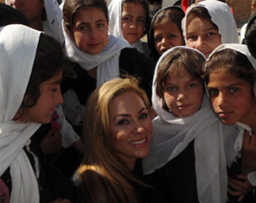 CSUEB alumna Shakira Niazi '93 with girls in her native Afghanistan. (vitawater.org)  