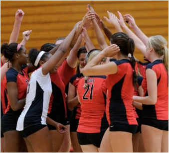 CSUEB volleyball team cheering before a game. (By: Michael Chen)