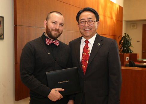 Cal State East Bay President Leroy M. Morishita nominated grad student David Fuller (left) for CSU scholar recognition. They were together at the Office of the Chancellor in Long Beach when Fuller was presented as an AT&T Scholar in late September. (By: CSU)