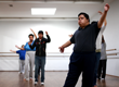 Several people dancing in studio.