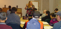 Ava Scofield leads an Aphasia Choir rehearsal.