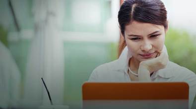 woman look at laptop screen