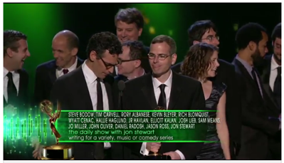 JR Havlan '87 (second from left) and the writers of "The Daily Show with Jon Stewart" accept the award for Outstanding Writing at the 2011 Emmys.