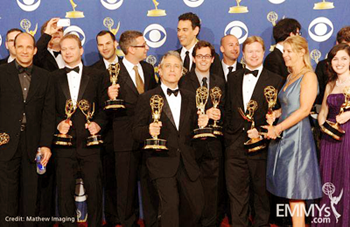 JR Havlan ’87 (far left) with his boss, Jon Stewart, and the Daily Show cast and crew backstage at the 2009 Emmy Awards. Photo: Mathew Imaging from Emmys.com