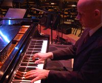 Johannes Wallmann playing the piano.