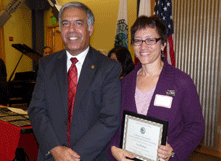 Lisa Booker was congratulated as Cunniffe Award recipient by University President Mo Qayoumi. (By: Barry Zepel)