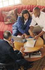 2 person signing document with a notary guy