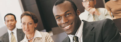 Man smiling in a meeting