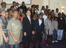 President Leroy Morishita standing with kids at church