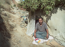 man sitting down on the ground