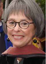 Rita Moreno, wearing her university regalia, at 2007 ceremony on the Hayward Campus. (by: Ben Ailes)