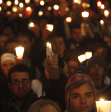 group of people holding candles