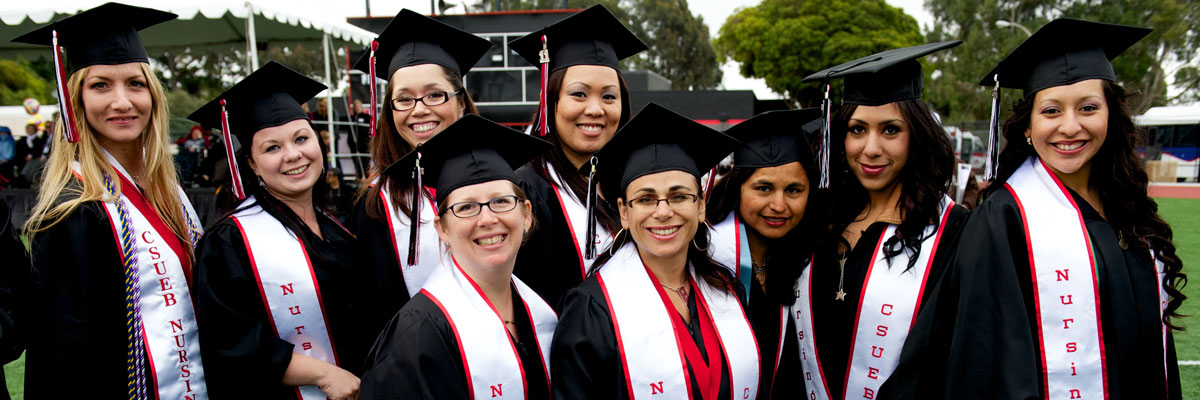 nursing student graduates smiling