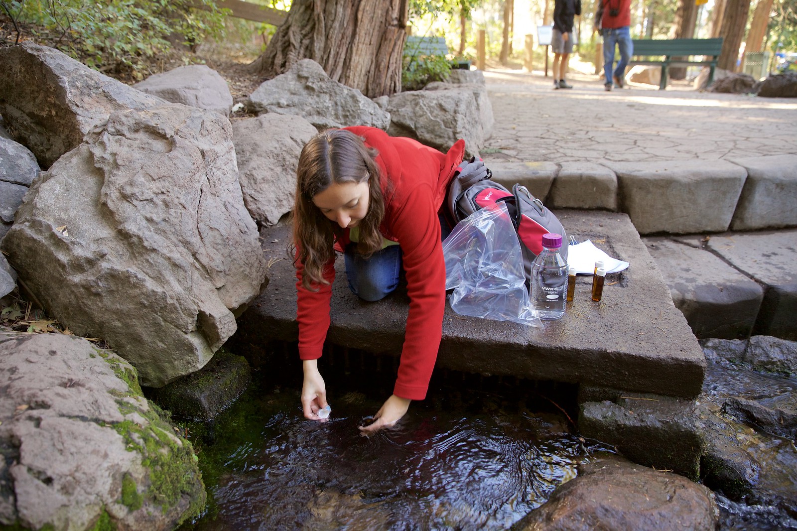 Student collecting a water sample
