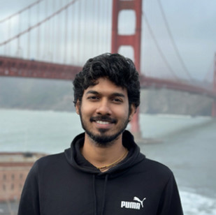 This is a headshot of SCAA graduate coordinator Mahesh with the Golden Gate Bridge in the background.
