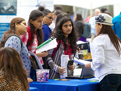 Student receiving information at a fair