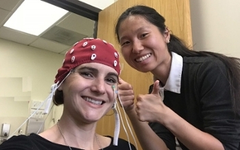 two students with brain lab equipment