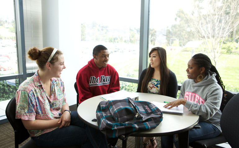 Students Getting Help from Staff Member