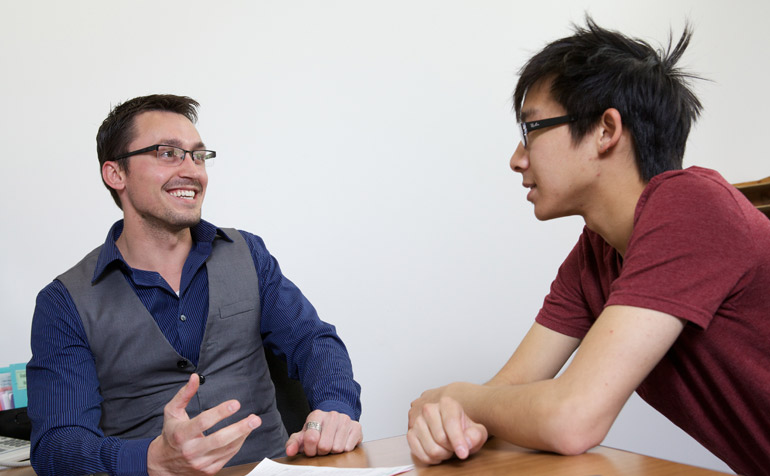 Faculty Member Talking to Student