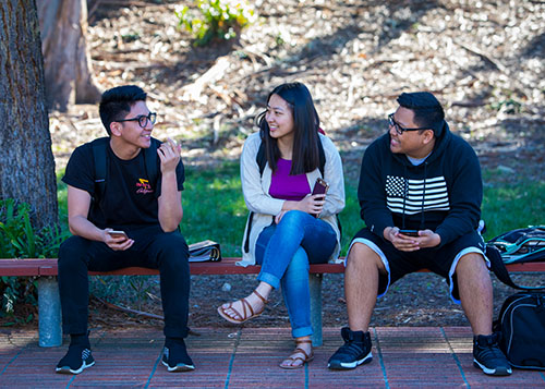 students chatting at AE building