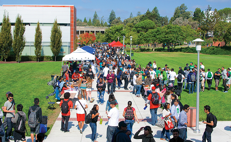 Students walking around at outdoor festival