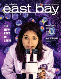 spring 2015 cover of scientist looking into microscope