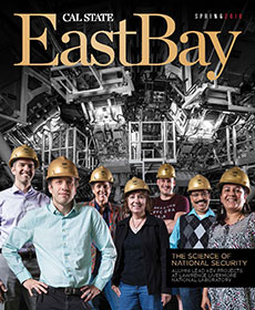 cover of the magazine with scientists in gold hard hats