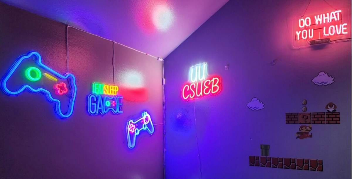 neon lights illuminate the game cave wall