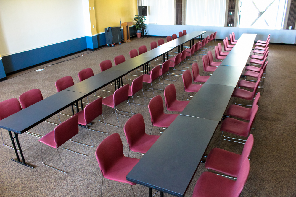 Two Long Tables in a Row with Chairs on Both Sides